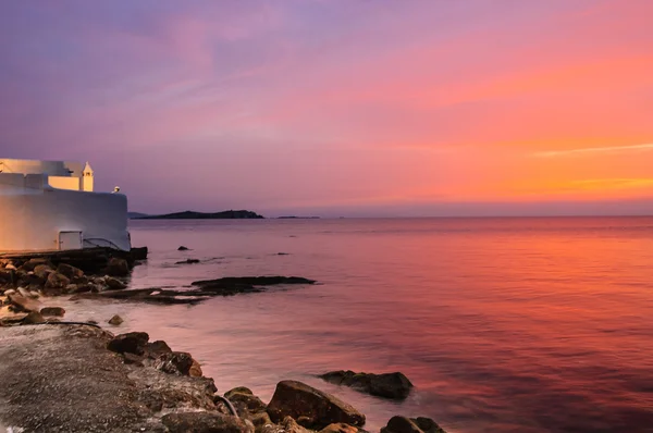 Sunset on Aegean sea near market building — Stock Photo, Image