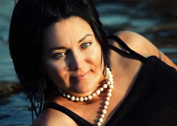 Portrait of brunette women in water — Stock Photo, Image