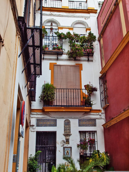 Very narrow traditional spanish street. Sevilla, Andalusia. Spain