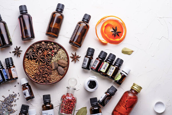  perfume ingridients around white background. Perfumer. beauty and trendy concept.  flat lay