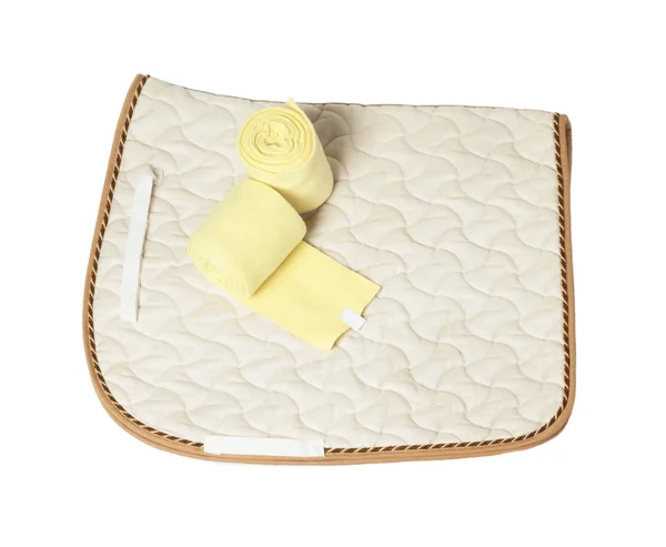Dressage champagne saddle cloth and yellow bandages  isolated on — Stock Photo, Image