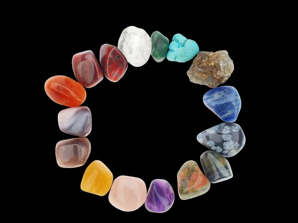 Färg spektrum av halv ädel stenar i cirkel ram, på bla — Stockfoto