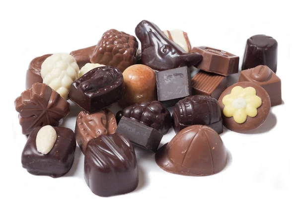 Verschillende chocolade op witte achtergrond - zoete voedsel — Stockfoto