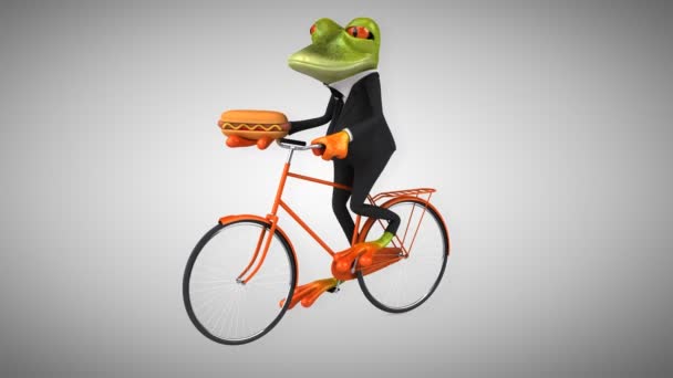 Fun cartoon frog on bicycle — Stock Video