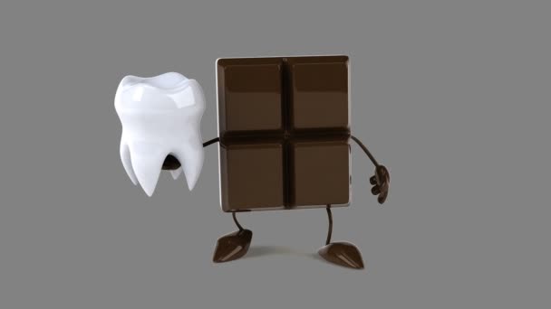 Chokladkaka håller tand — Stockvideo