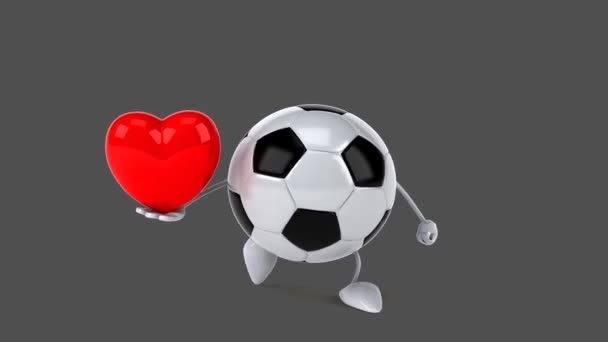 Fútbol sosteniendo corazón rojo — Vídeo de stock