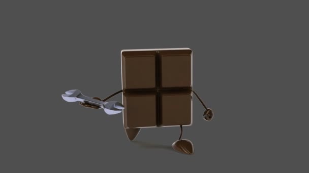 Čokoládovou tyčinku drží klíč — Stock video