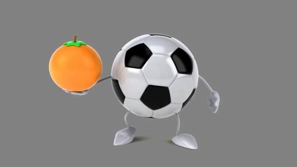 Pelota de fútbol con una naranja — Vídeo de stock