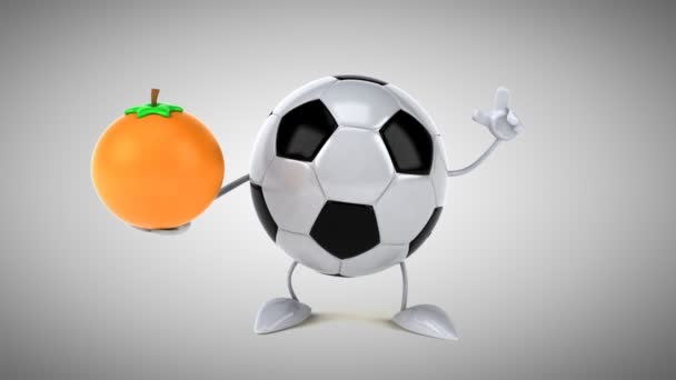 Football ball with an orange — Stock Video