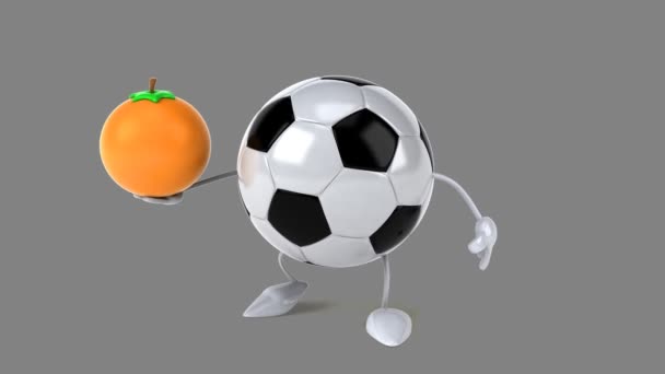 Fotboll bollen med en orange — Stockvideo