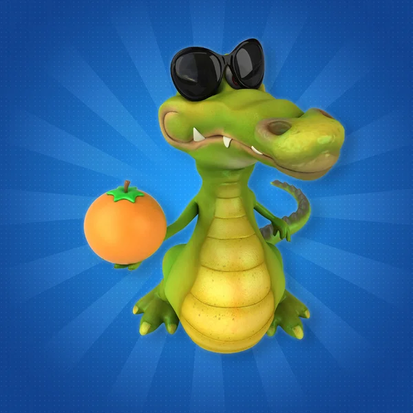 Crocodile holding orange — Stock Photo, Image