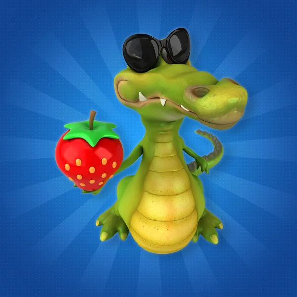 Crocodile holding strawberry — стоковое фото