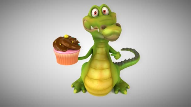 Krokodil hält Cupcake — Stockvideo