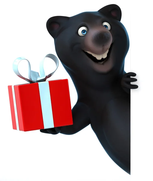 Černý medvěd s dárkem — Stock fotografie