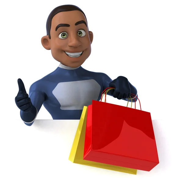 Fun superhero with shopping bags — Stock Photo, Image