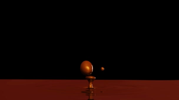 Gota de chocolate com o efeito de foco (gota 2) no fundo preto — Vídeo de Stock