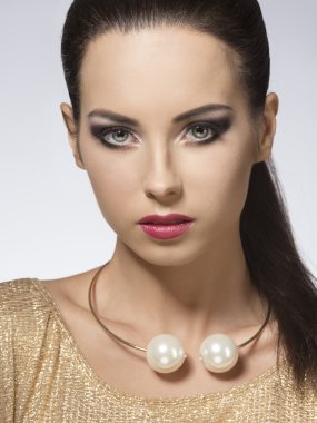 pretty brunette with golden  style