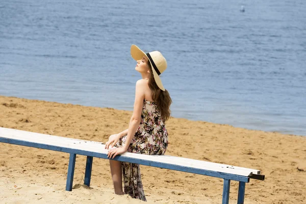 Sweet girl on beach with hat — 스톡 사진