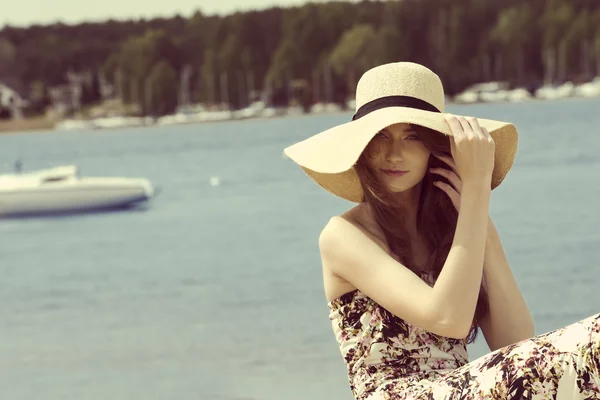 Summer girl with hat near lake.vintage color — 스톡 사진