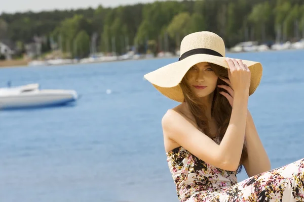 Summer girl with hat near lake.vintage color — Stok fotoğraf
