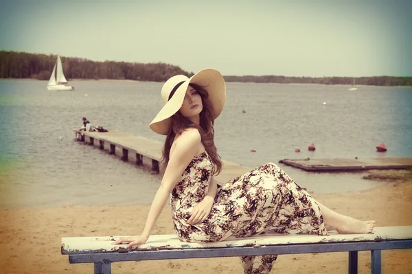 Vintage color effect summer shot of girl on the beach — Zdjęcie stockowe