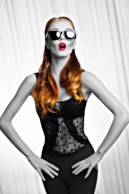 girl with sunglasses in fashion pose .BW shot