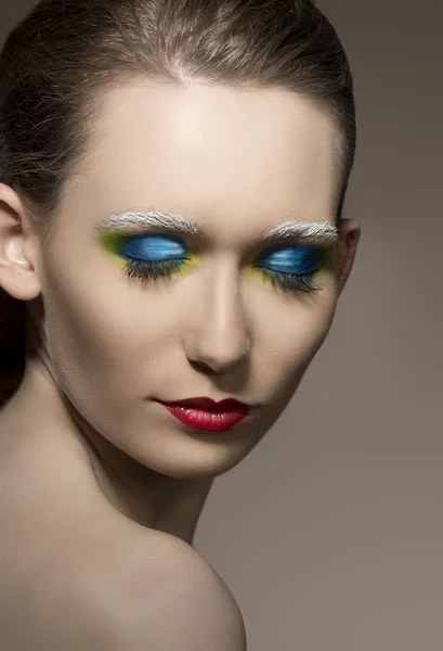 Close-up van meisje met creatieve make-up — Stockfoto