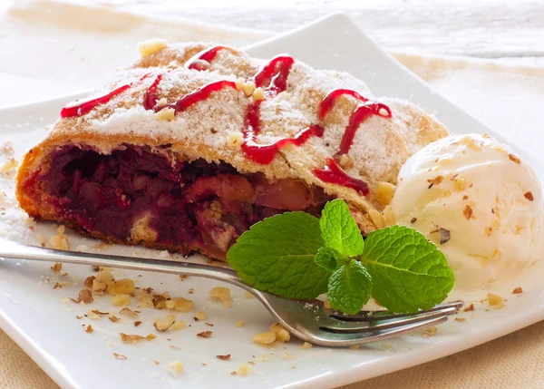 Strudel with apples and cherries — Stock Photo, Image