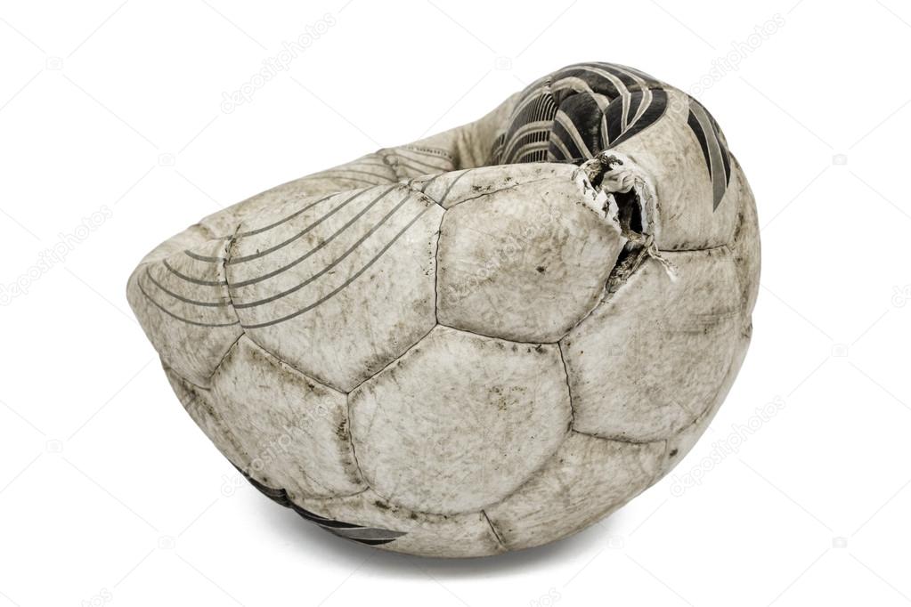 Old torn soccer ball, isolated on white background