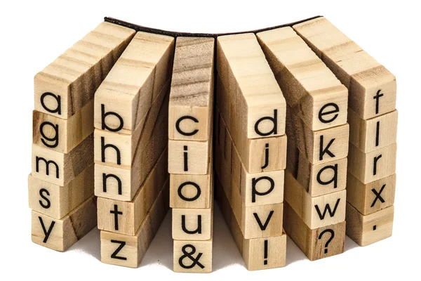 Letters of the English alphabet on the ends of wooden bars, isol — Stock Photo, Image