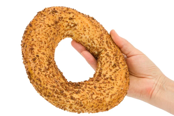 Női kezében friss bagel, elszigetelt fehér background — Stock Fotó