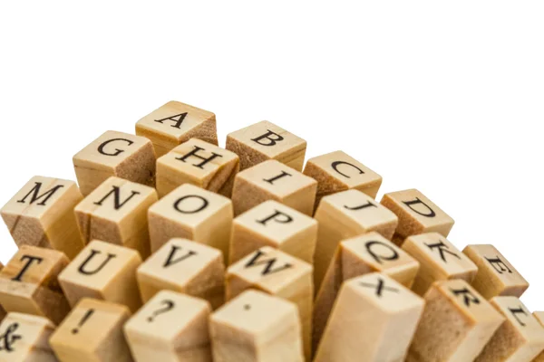 Letters of the English alphabet on the ends of wooden bars, isol — Stock Photo, Image