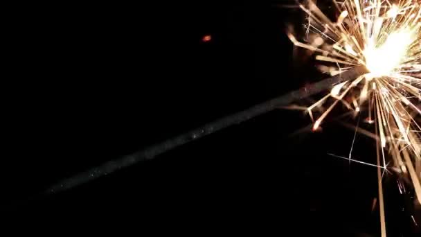 Last minute sparklers on black background — Stock Video