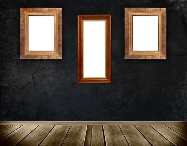 Dark wall and wooden frames. — Stock Photo, Image