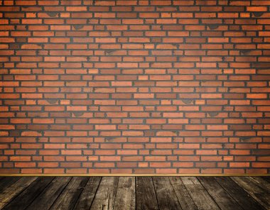 Kırmızı tuğla duvar ve eski ahşap zemin.