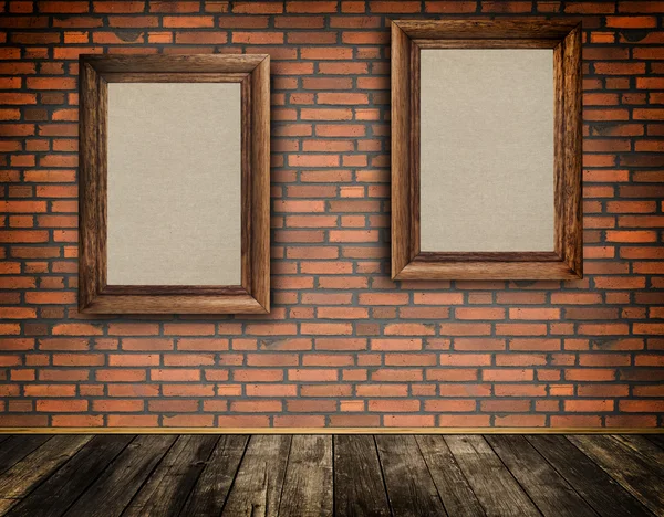 Old frames on a bricks wall. — Stock Photo, Image