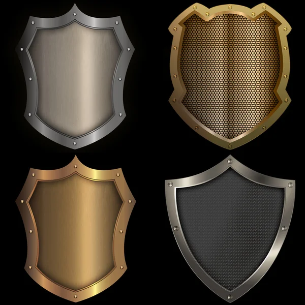 Gold and silver shields set on black background. — Stock Photo, Image