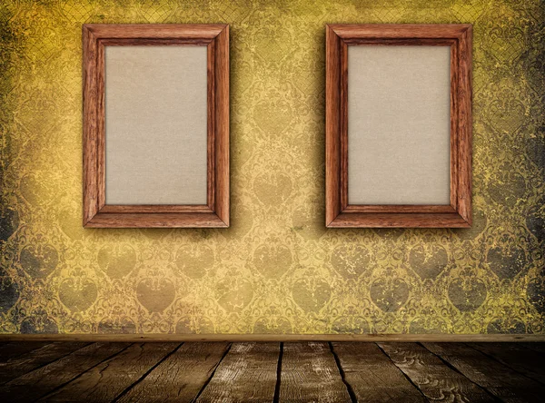 Two wooden frames on wall. — Stock Photo, Image