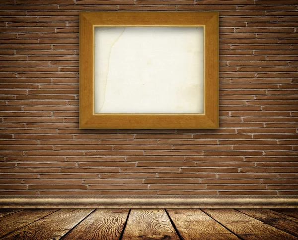 Old-fashioned wooden frame on brick wall. — Stock Photo, Image