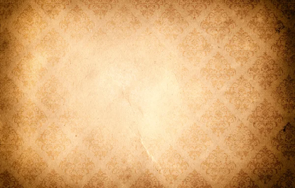 Old grunge paper background with ornament. — Stock Photo, Image