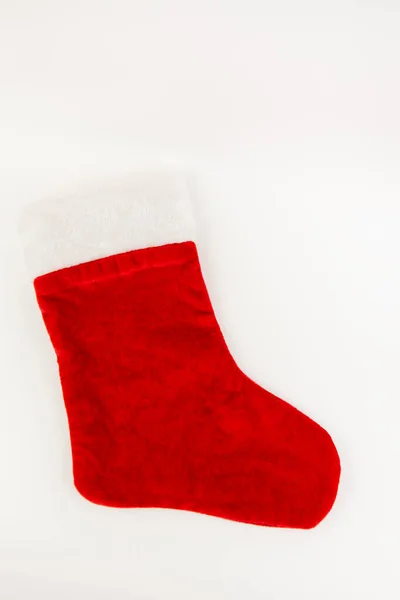 Czerwona pończocha Mikołaja na białym tle. Koncepcja świąt lub świąt. — Zdjęcie stockowe