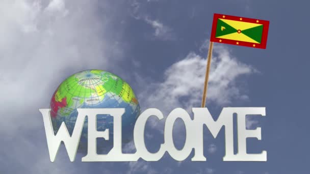 Поворотний глобус і невелику паперову прапор Гренади — стокове відео