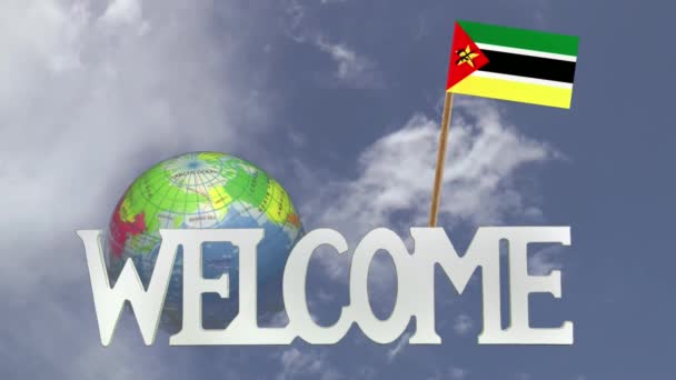 Turning globe and small paper flag of  MOZAMBIQUE — Stock Video