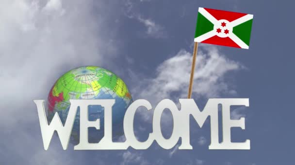 Otáčející se kouli a malé papírové vlajka Burundi — Stock video