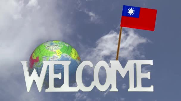 Поворотный глобус и маленький бумажный флаг Тайваня — стоковое видео