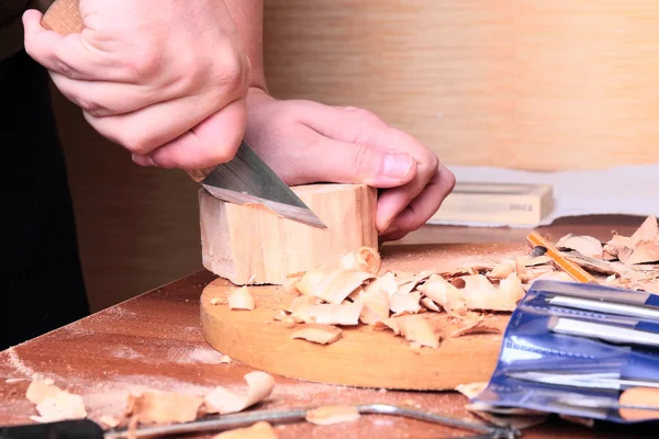 Carpenter hand carving wood — Stock Photo, Image