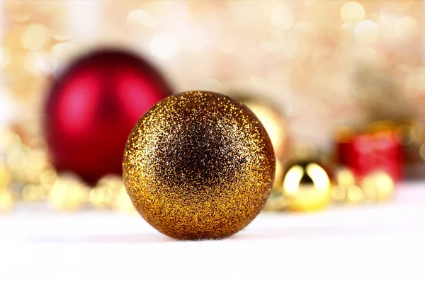 Golden christmas ball on abstract background — Stock Photo, Image