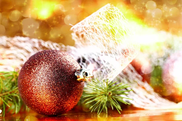 Golden christmas ball on abstract background — Stock Photo, Image