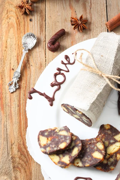 Chocolate sausage with decorations — Stock Photo, Image