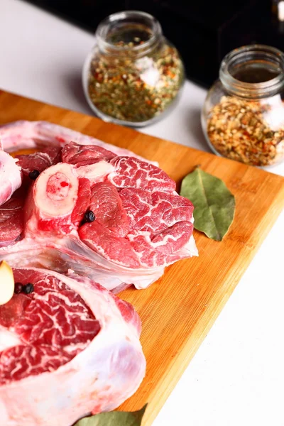 Raw meat with spices — Stock Photo, Image